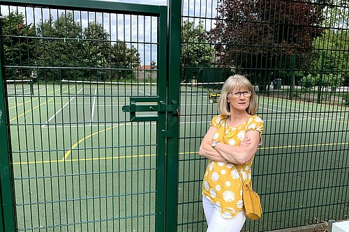 Cllr Gould outside one of the tennis courts affected