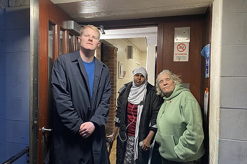 Cllr Ben Curtis (left), Amino Mahdi (centre), and Sue Woody (right) in front of Selby House, Oaklands Estate.  