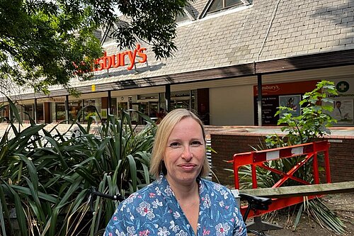 Cllr Claire Bonham outside Sainsbury's, next to the proposed development site.